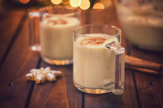 two glasses of eggnog latte, the perfect Christmas treat while you read a book